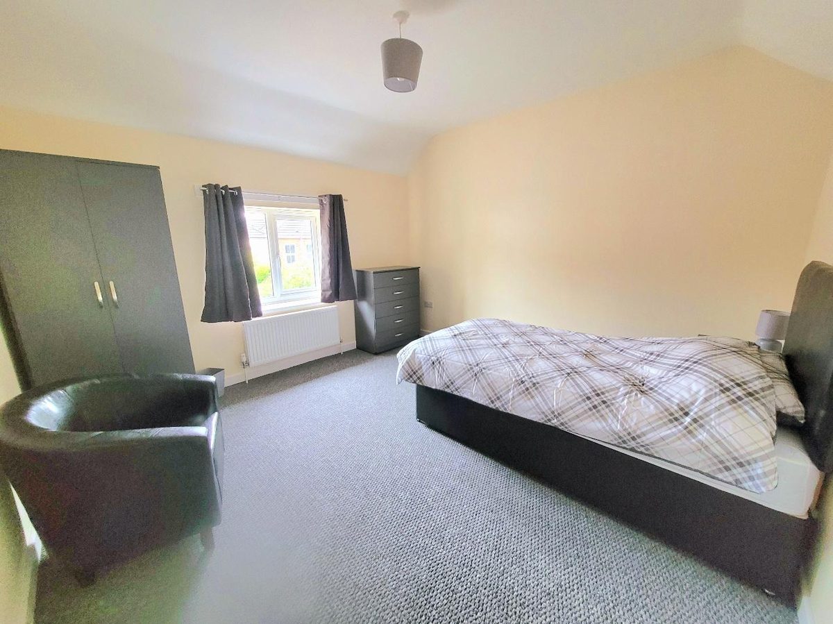 Every resident gets their own furnished room — bed, wardrobe, drawers and a chair of their own.
